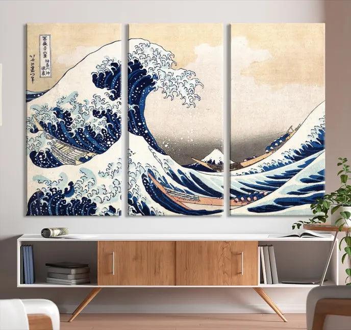 A triptych canvas print titled "Hokusai: The Breaking Wave off Kanagawa" in traditional Japanese style is elegantly displayed on museum-quality canvases with a UV-protective coating. Its blue and white hues are gallery wrapped, creating an artistic focal point.