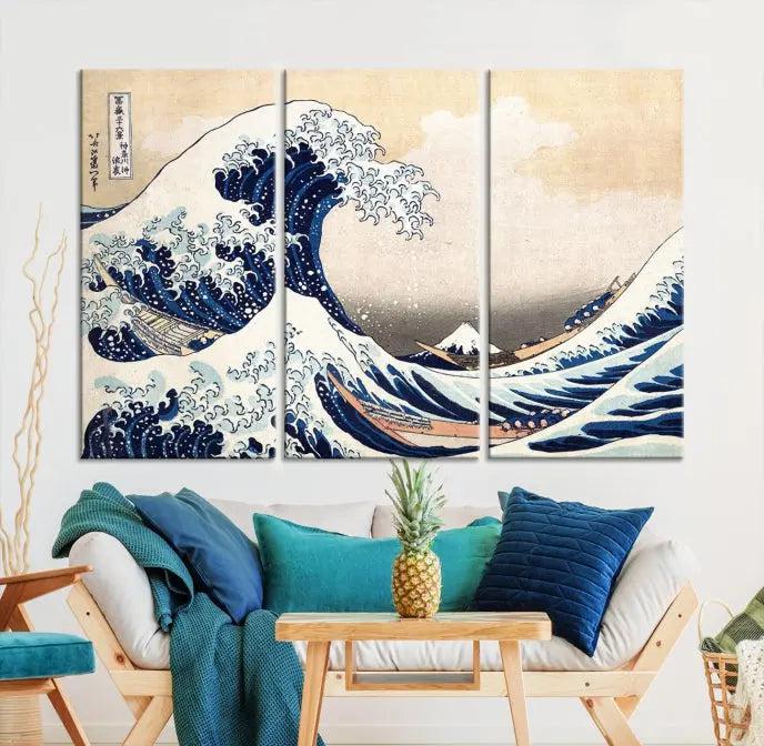 A triptych canvas print titled "Hokusai: The Breaking Wave off Kanagawa" in traditional Japanese style is elegantly displayed on museum-quality canvases with a UV-protective coating. Its blue and white hues are gallery wrapped, creating an artistic focal point.