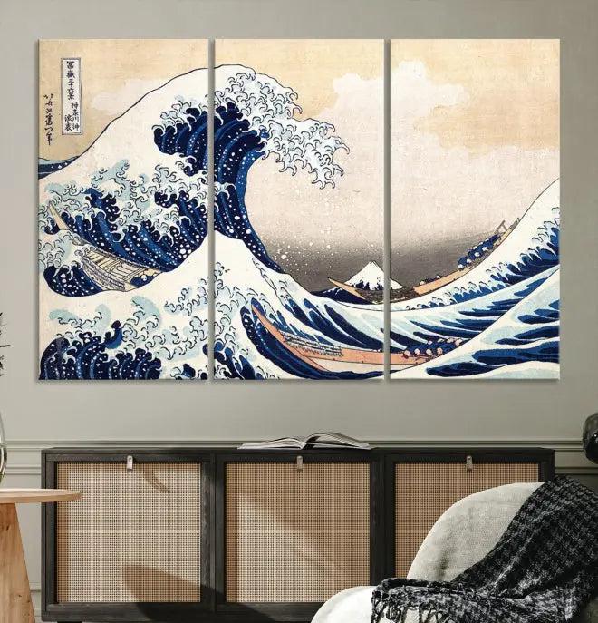 A triptych canvas print titled "Hokusai: The Breaking Wave off Kanagawa" in traditional Japanese style is elegantly displayed on museum-quality canvases with a UV-protective coating. Its blue and white hues are gallery wrapped, creating an artistic focal point.