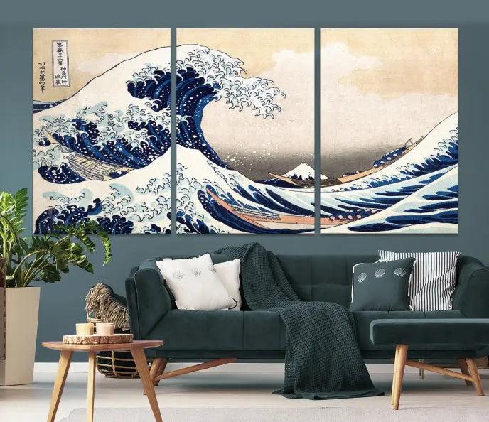 A triptych canvas print titled "Hokusai: The Breaking Wave off Kanagawa" in traditional Japanese style is elegantly displayed on museum-quality canvases with a UV-protective coating. Its blue and white hues are gallery wrapped, creating an artistic focal point.