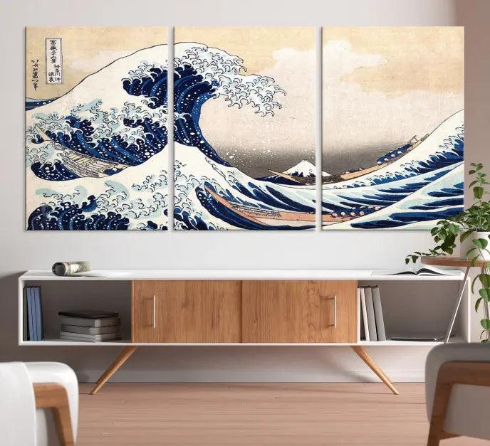 A triptych canvas print titled "Hokusai: The Breaking Wave off Kanagawa" in traditional Japanese style is elegantly displayed on museum-quality canvases with a UV-protective coating. Its blue and white hues are gallery wrapped, creating an artistic focal point.