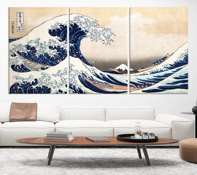 A triptych canvas print titled "Hokusai: The Breaking Wave off Kanagawa" in traditional Japanese style is elegantly displayed on museum-quality canvases with a UV-protective coating. Its blue and white hues are gallery wrapped, creating an artistic focal point.