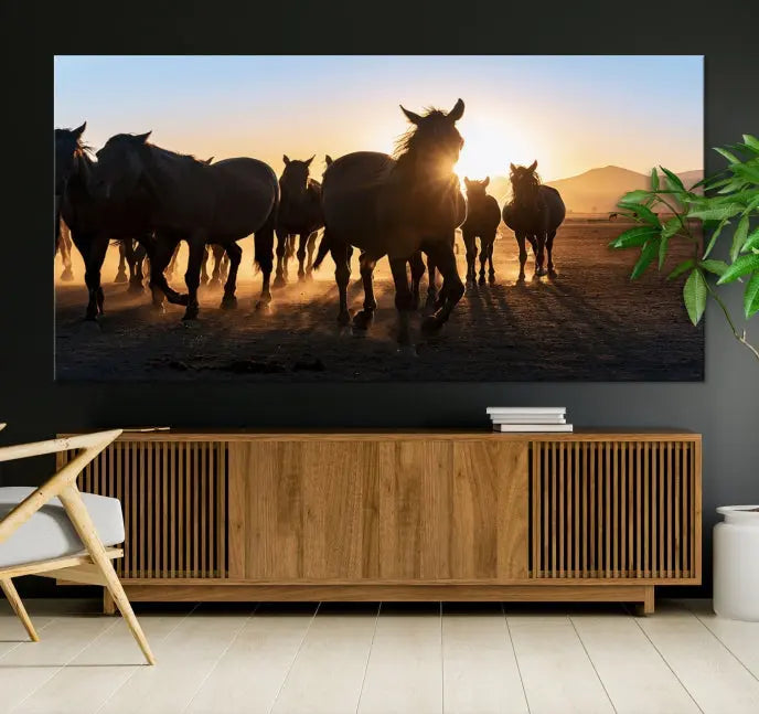 The Horse Herd Wall Art Animal Canvas Print features a triptych of galloping horses at sunset, hand-assembled on museum-quality canvas. This captivating masterpiece beautifully adorns the living room wall. Enjoy free shipping to easily welcome it into your home.