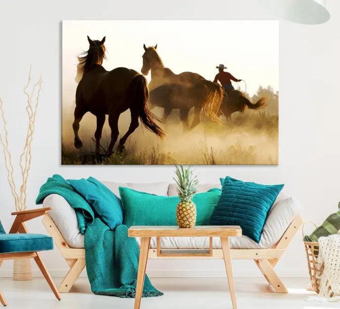 Introducing the "Horses and Cowboys Wall Art Canvas Print": a stunning three-panel artwork featuring horses and a rider, highlighted by the silhouette of a cowboy amidst a dusty sunset landscape. This masterpiece is crafted on museum-quality canvas, with each section gallery wrapped and finished with a UV-protective coating to maintain its vividness and elegance over time.