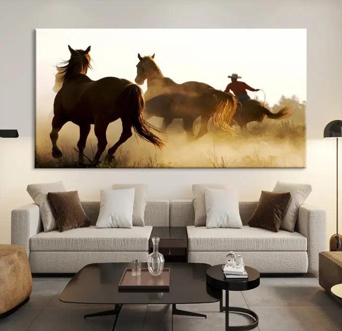 Introducing the "Horses and Cowboys Wall Art Canvas Print": a stunning three-panel artwork featuring horses and a rider, highlighted by the silhouette of a cowboy amidst a dusty sunset landscape. This masterpiece is crafted on museum-quality canvas, with each section gallery wrapped and finished with a UV-protective coating to maintain its vividness and elegance over time.