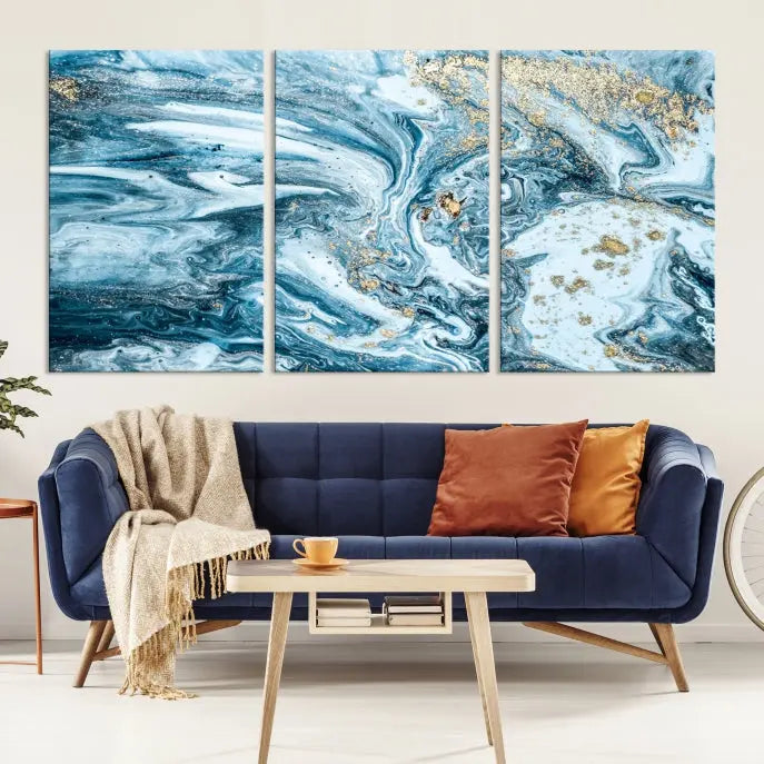 An eye-catching abstract wall art piece titled "Ice Blue Marble Fluid Effect" comes in a three-panel canvas. It is crafted on museum-quality polycotton canvas and features a UV-protective coating, making it an elegant addition to any living space.