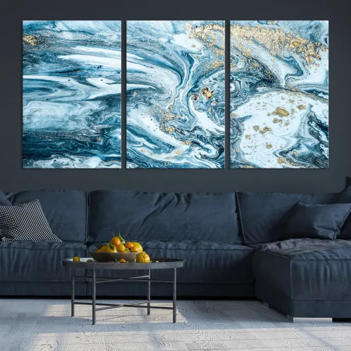 An eye-catching abstract wall art piece titled "Ice Blue Marble Fluid Effect" comes in a three-panel canvas. It is crafted on museum-quality polycotton canvas and features a UV-protective coating, making it an elegant addition to any living space.