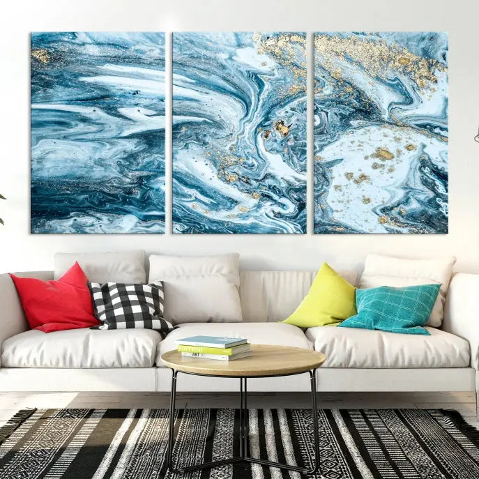 An eye-catching abstract wall art piece titled "Ice Blue Marble Fluid Effect" comes in a three-panel canvas. It is crafted on museum-quality polycotton canvas and features a UV-protective coating, making it an elegant addition to any living space.