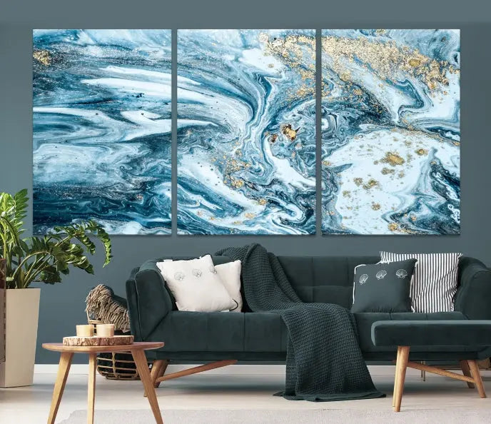 An eye-catching abstract wall art piece titled "Ice Blue Marble Fluid Effect" comes in a three-panel canvas. It is crafted on museum-quality polycotton canvas and features a UV-protective coating, making it an elegant addition to any living space.