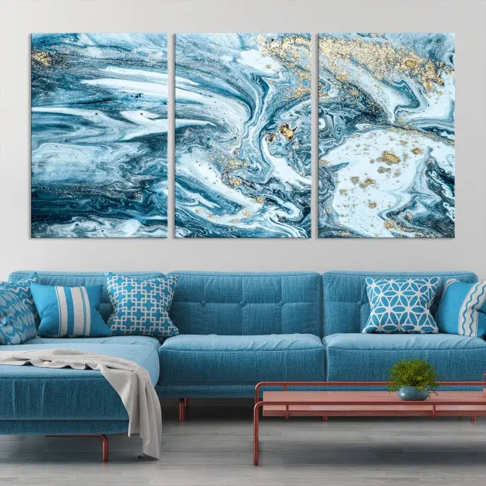 An eye-catching abstract wall art piece titled "Ice Blue Marble Fluid Effect" comes in a three-panel canvas. It is crafted on museum-quality polycotton canvas and features a UV-protective coating, making it an elegant addition to any living space.