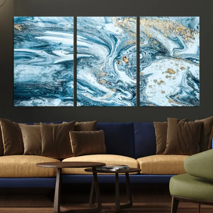 An eye-catching abstract wall art piece titled "Ice Blue Marble Fluid Effect" comes in a three-panel canvas. It is crafted on museum-quality polycotton canvas and features a UV-protective coating, making it an elegant addition to any living space.