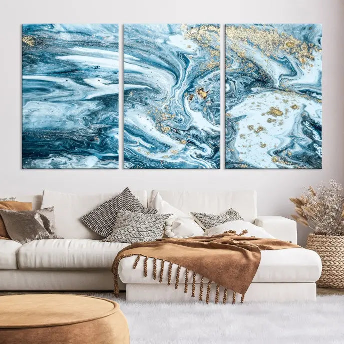 An eye-catching abstract wall art piece titled "Ice Blue Marble Fluid Effect" comes in a three-panel canvas. It is crafted on museum-quality polycotton canvas and features a UV-protective coating, making it an elegant addition to any living space.