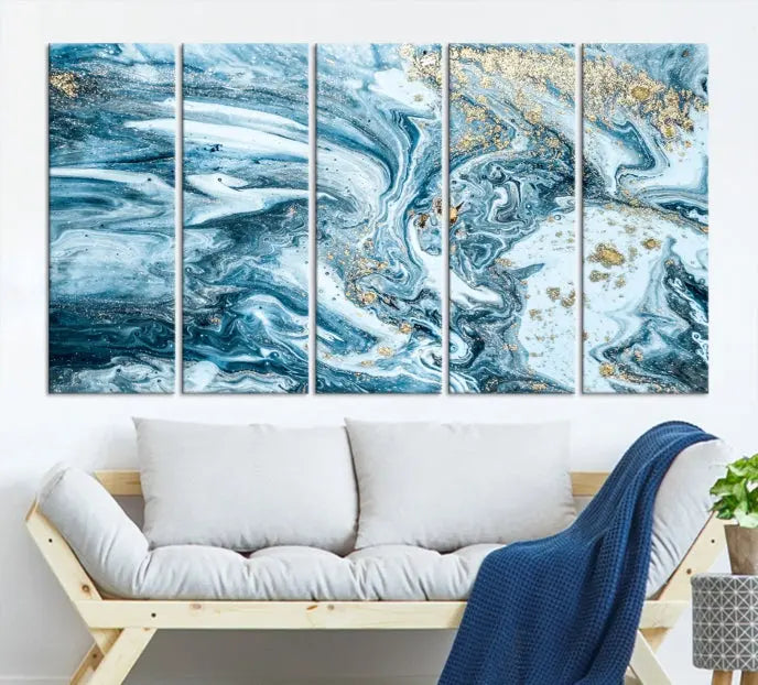 An eye-catching abstract wall art piece titled "Ice Blue Marble Fluid Effect" comes in a three-panel canvas. It is crafted on museum-quality polycotton canvas and features a UV-protective coating, making it an elegant addition to any living space.