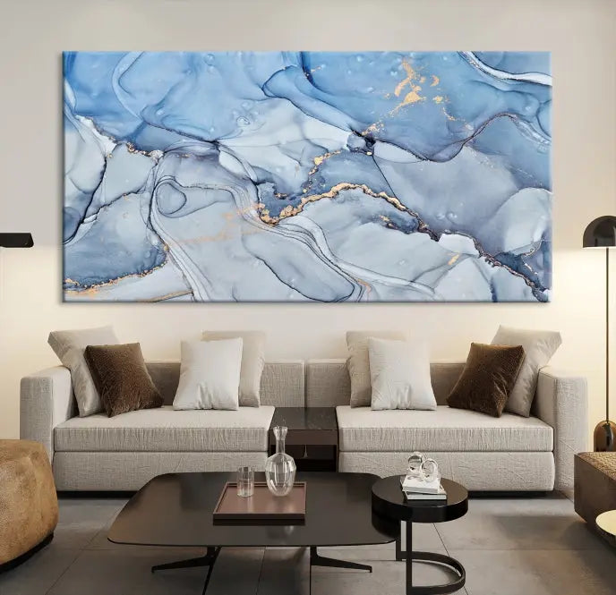 The "Ice Blue Marble Fluid Effect" abstract canvas wall art print, featuring a three-panel design, adorns the wall.