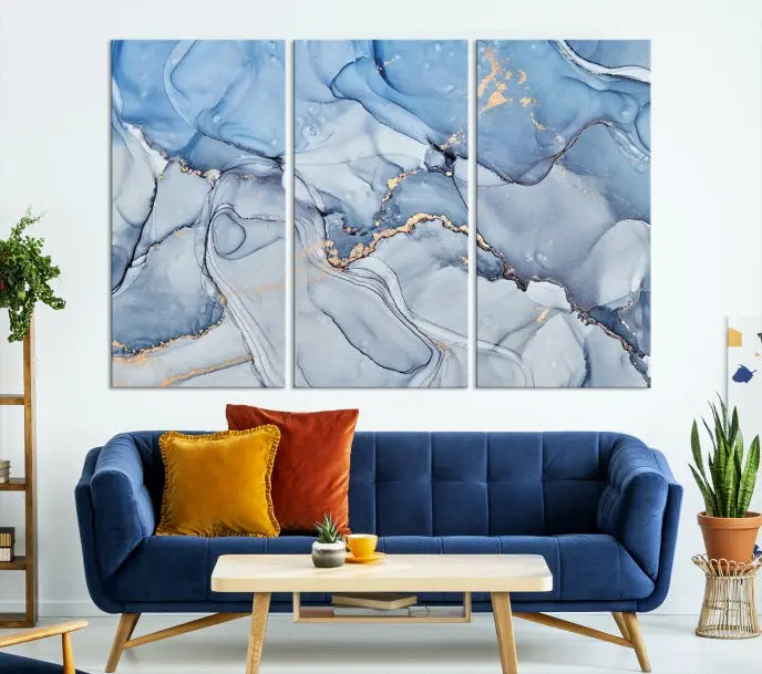 The "Ice Blue Marble Fluid Effect" abstract canvas wall art print, featuring a three-panel design, adorns the wall.