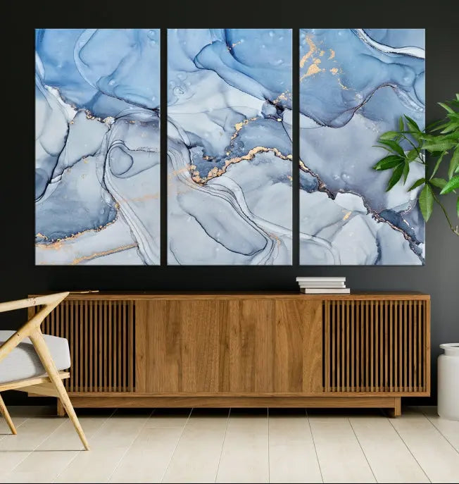 The "Ice Blue Marble Fluid Effect" abstract canvas wall art print, featuring a three-panel design, adorns the wall.