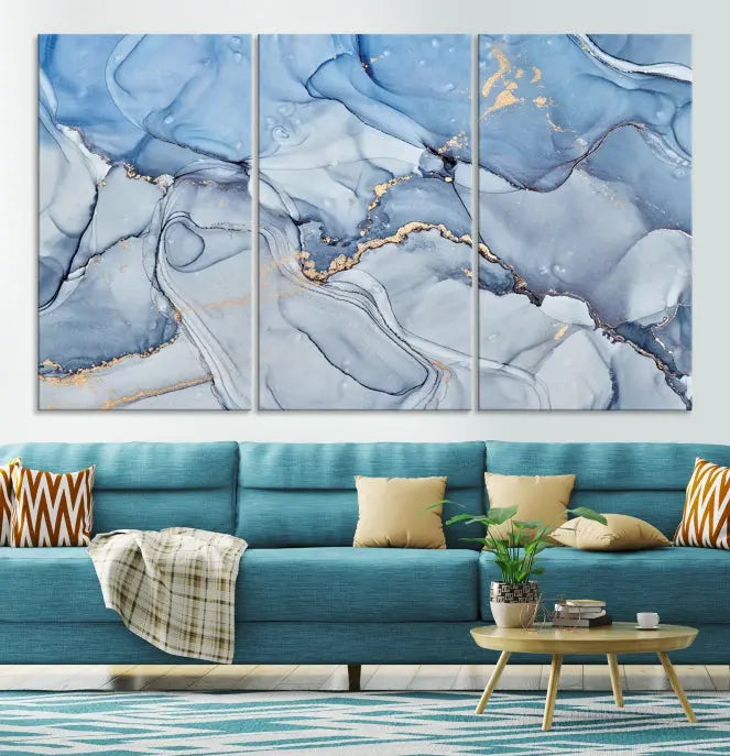 The "Ice Blue Marble Fluid Effect" abstract canvas wall art print, featuring a three-panel design, adorns the wall.