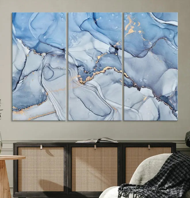 The "Ice Blue Marble Fluid Effect" abstract canvas wall art print, featuring a three-panel design, adorns the wall.