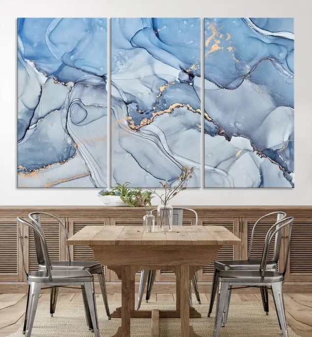 The "Ice Blue Marble Fluid Effect" abstract canvas wall art print, featuring a three-panel design, adorns the wall.