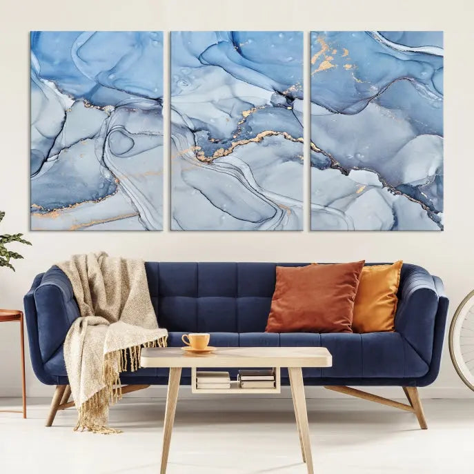 The "Ice Blue Marble Fluid Effect" abstract canvas wall art print, featuring a three-panel design, adorns the wall.