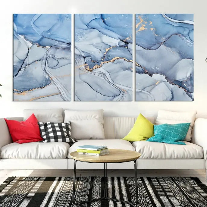 The "Ice Blue Marble Fluid Effect" abstract canvas wall art print, featuring a three-panel design, adorns the wall.