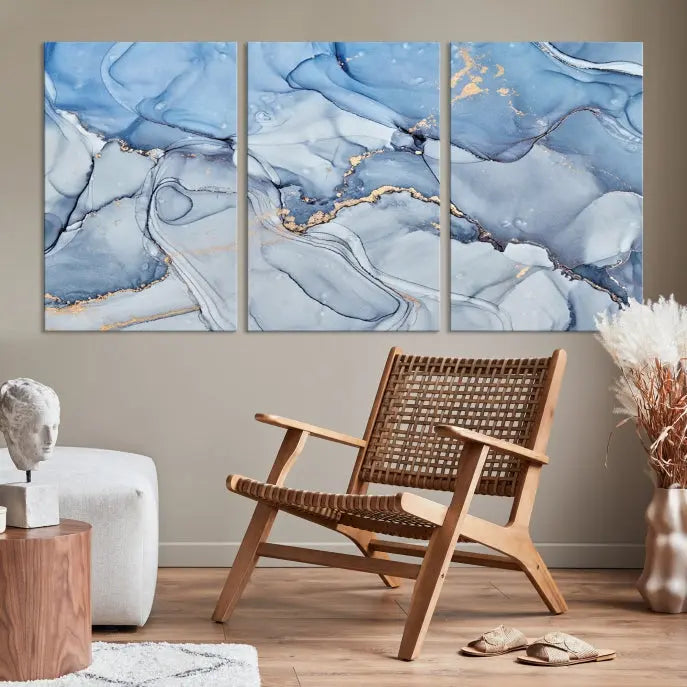 The "Ice Blue Marble Fluid Effect" abstract canvas wall art print, featuring a three-panel design, adorns the wall.