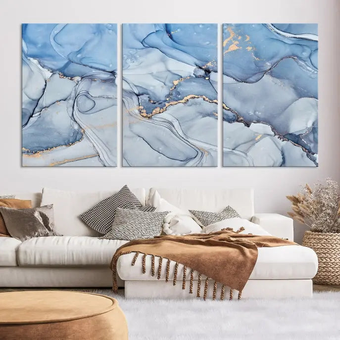 The "Ice Blue Marble Fluid Effect" abstract canvas wall art print, featuring a three-panel design, adorns the wall.