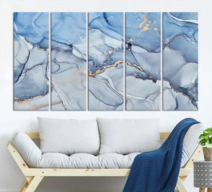 The "Ice Blue Marble Fluid Effect" abstract canvas wall art print, featuring a three-panel design, adorns the wall.