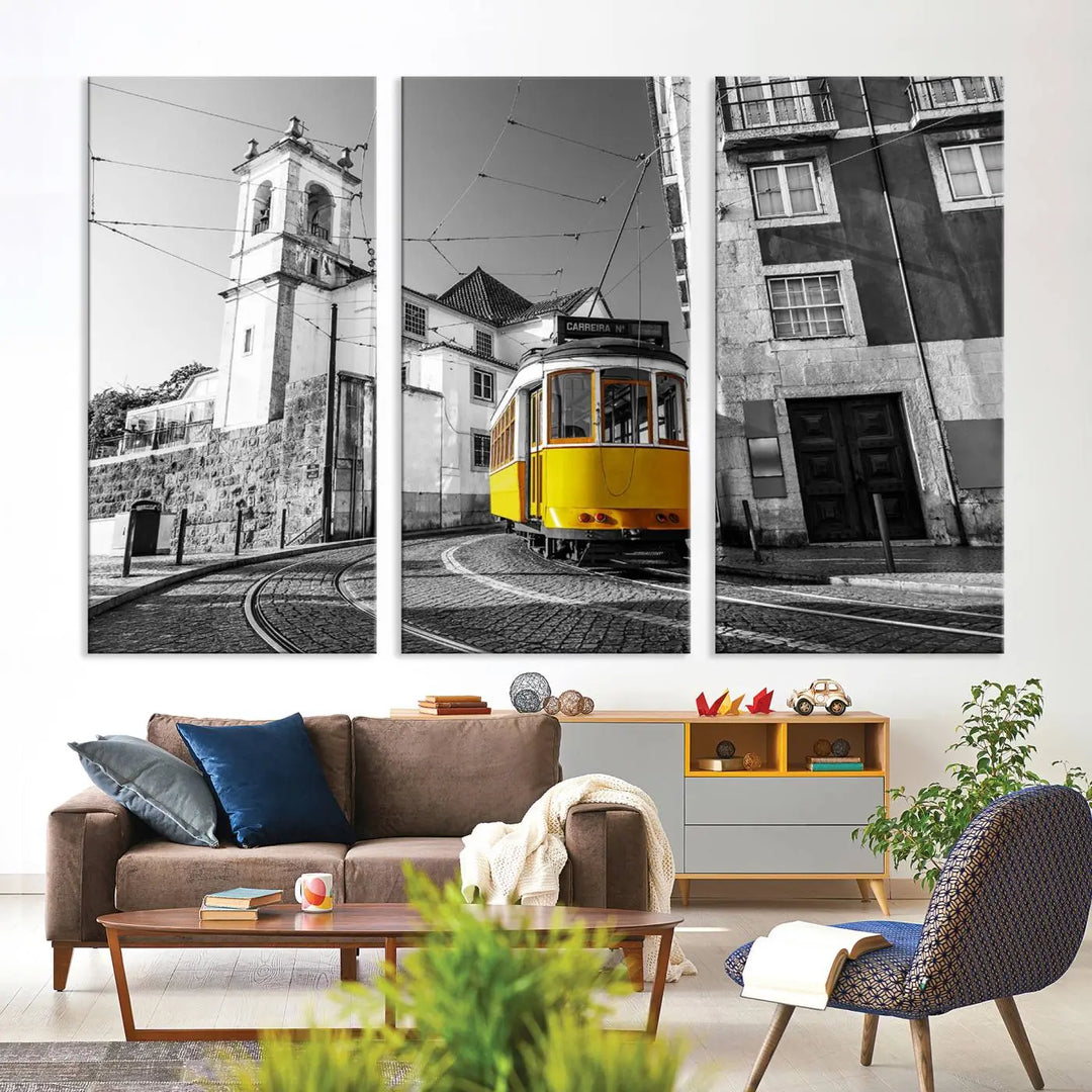 The Iconic Yellow Lisbon Tram Canvas Wall Art Print showcases a yellow tram navigating through a monochrome street scene, with a historic building in the background, exquisitely captured on museum-quality canvas.