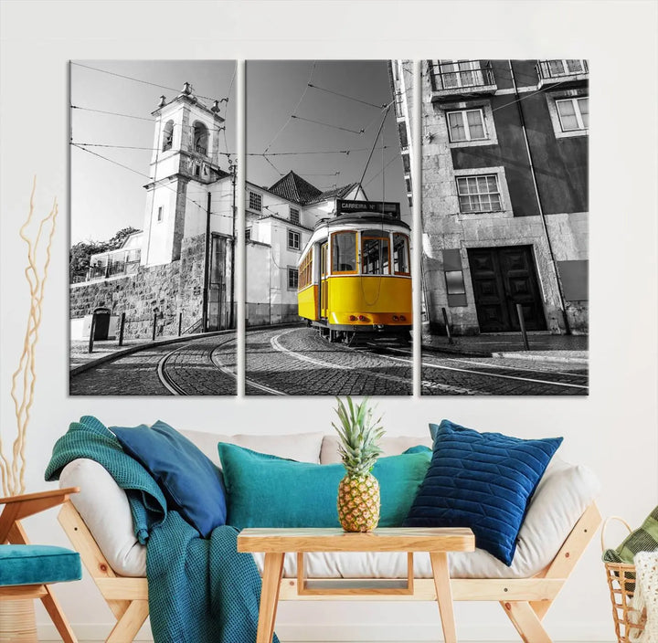 The Iconic Yellow Lisbon Tram Canvas Wall Art Print showcases a yellow tram navigating through a monochrome street scene, with a historic building in the background, exquisitely captured on museum-quality canvas.