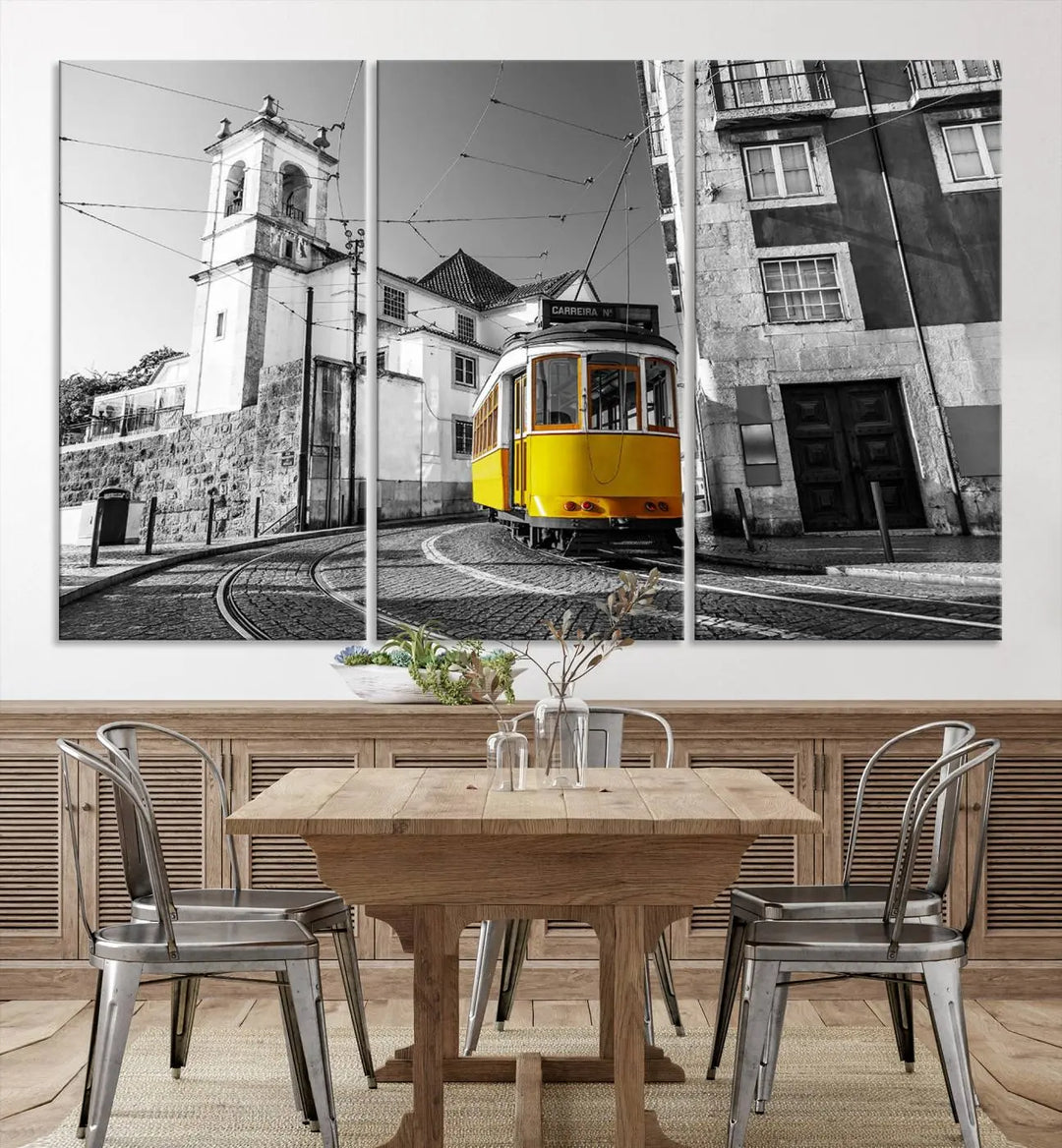 The Iconic Yellow Lisbon Tram Canvas Wall Art Print showcases a yellow tram navigating through a monochrome street scene, with a historic building in the background, exquisitely captured on museum-quality canvas.