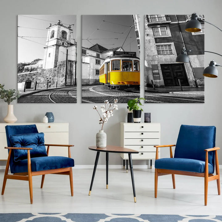 The Iconic Yellow Lisbon Tram Canvas Wall Art Print showcases a yellow tram navigating through a monochrome street scene, with a historic building in the background, exquisitely captured on museum-quality canvas.