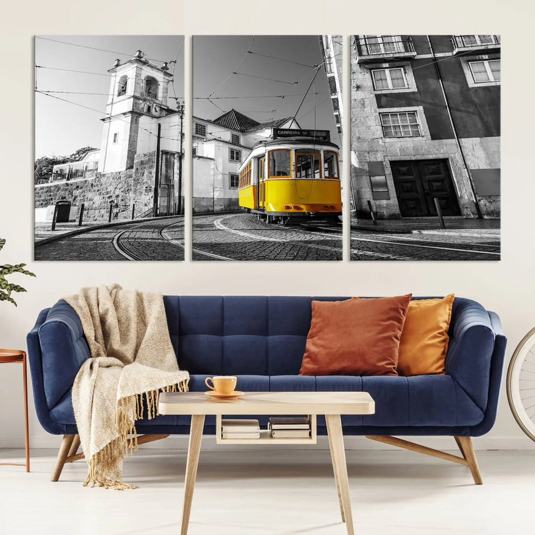 The Iconic Yellow Lisbon Tram Canvas Wall Art Print showcases a yellow tram navigating through a monochrome street scene, with a historic building in the background, exquisitely captured on museum-quality canvas.