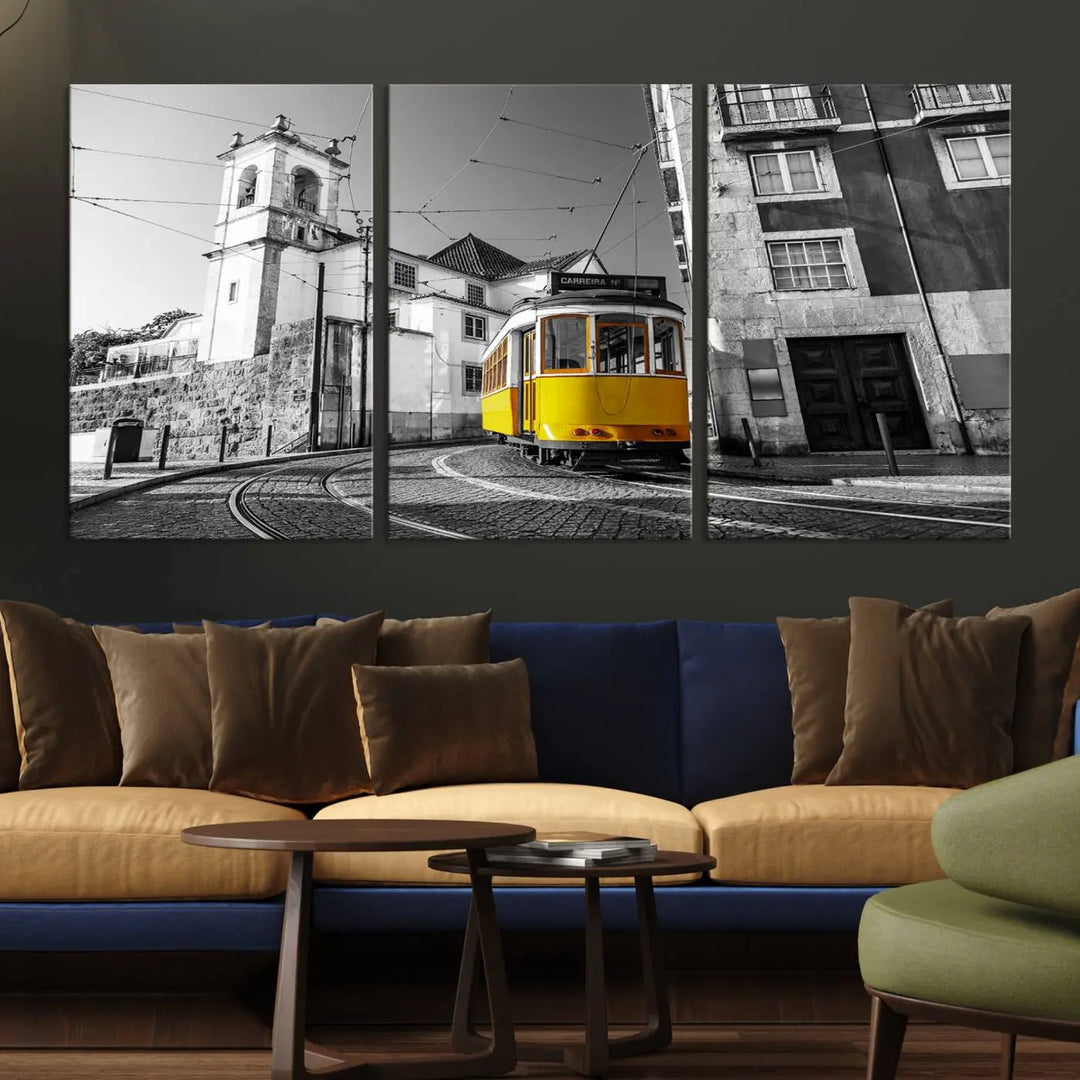 The Iconic Yellow Lisbon Tram Canvas Wall Art Print showcases a yellow tram navigating through a monochrome street scene, with a historic building in the background, exquisitely captured on museum-quality canvas.