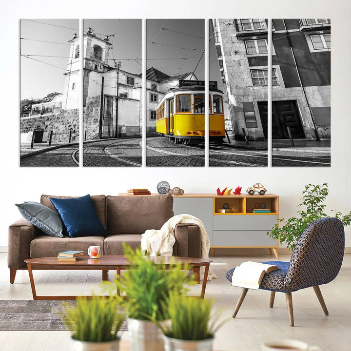 The Iconic Yellow Lisbon Tram Canvas Wall Art Print showcases a yellow tram navigating through a monochrome street scene, with a historic building in the background, exquisitely captured on museum-quality canvas.