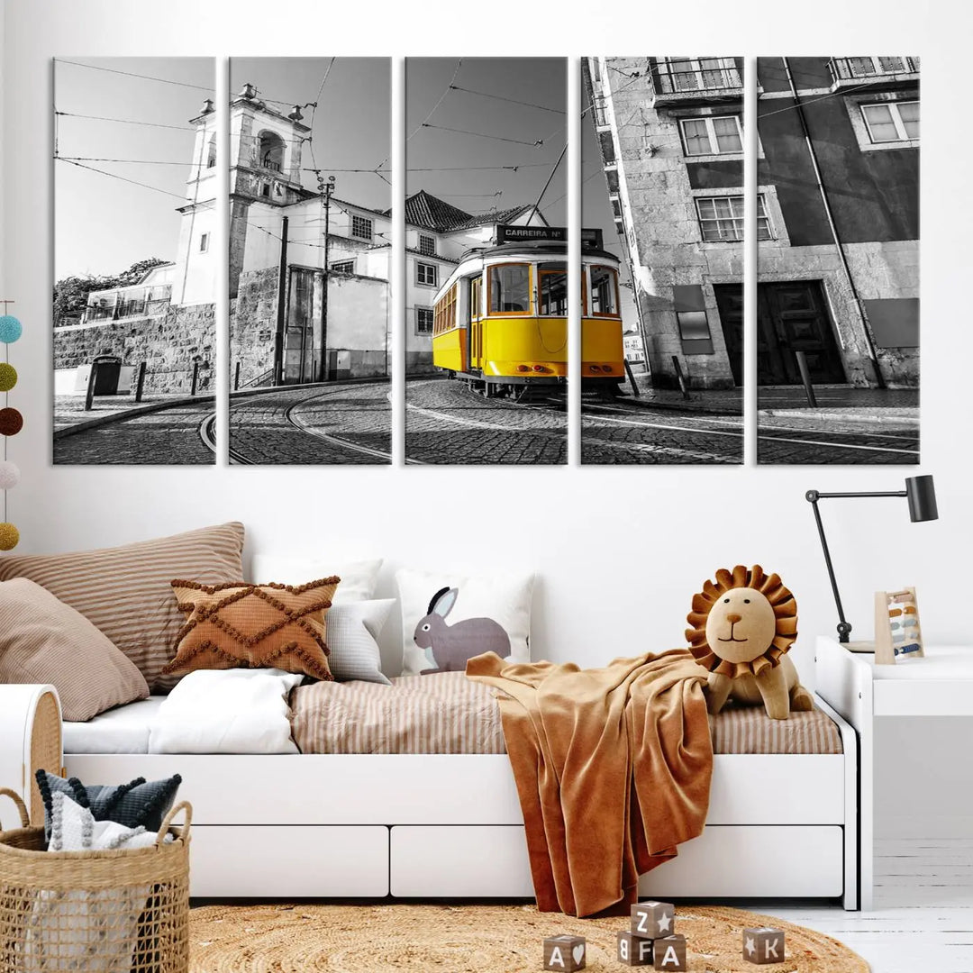 The Iconic Yellow Lisbon Tram Canvas Wall Art Print showcases a yellow tram navigating through a monochrome street scene, with a historic building in the background, exquisitely captured on museum-quality canvas.