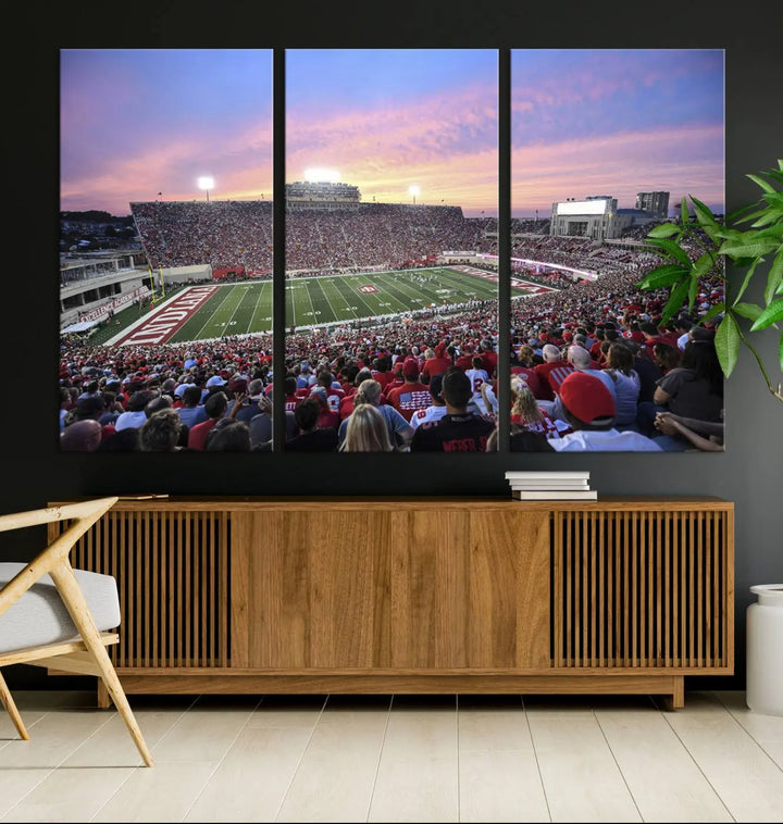 Living room featuring the Indiana University Hoosiers Football Team Print - Bloomington Memorial Stadium Wall Art Canvas Print, showcasing a packed football stadium at sunset for a gallery-quality finish.