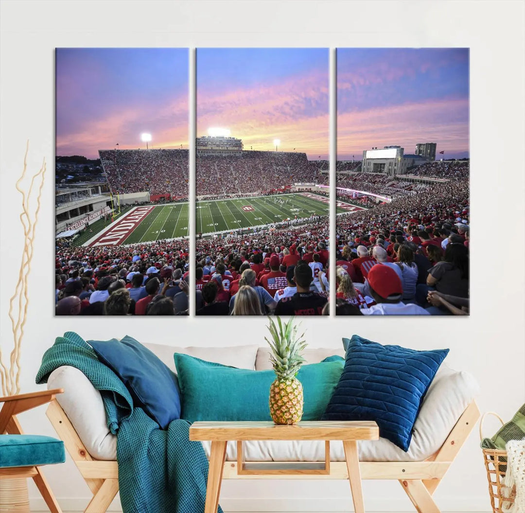 Living room featuring the Indiana University Hoosiers Football Team Print - Bloomington Memorial Stadium Wall Art Canvas Print, showcasing a packed football stadium at sunset for a gallery-quality finish.