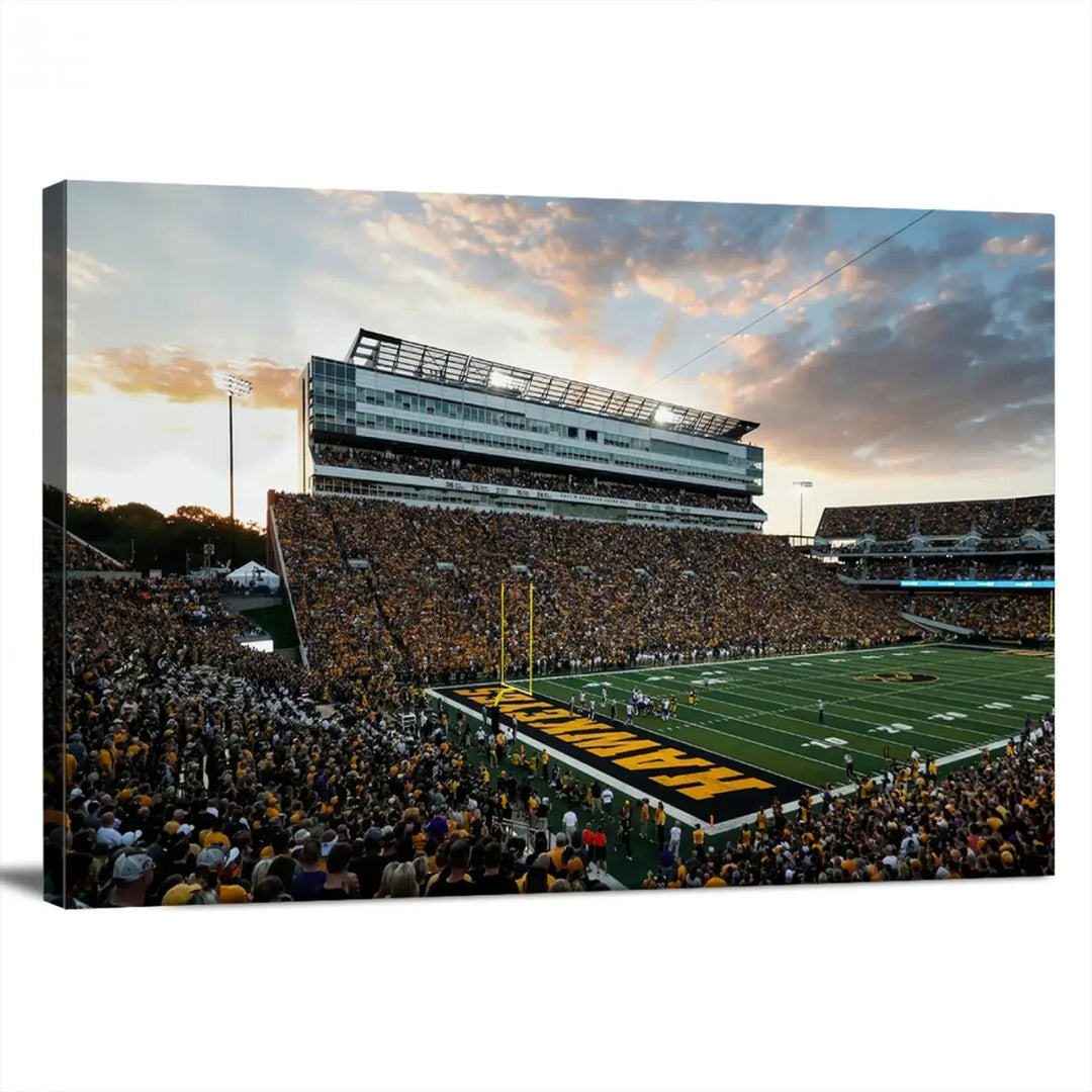 The Iowa University Hawkeyes Football Team Print, featuring a depiction of Kinnick Stadium in Iowa City at sunset and finished on a gallery-quality canvas, is displayed prominently.