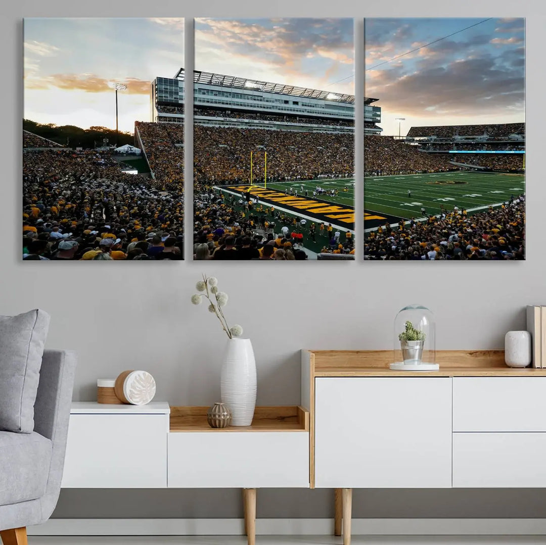 The Iowa University Hawkeyes Football Team Print, featuring a depiction of Kinnick Stadium in Iowa City at sunset and finished on a gallery-quality canvas, is displayed prominently.