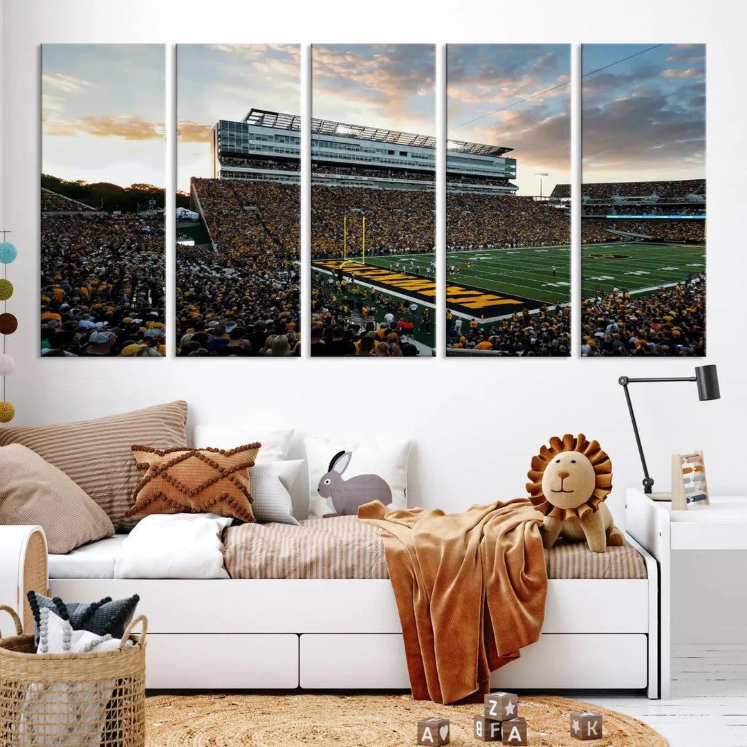 The Iowa University Hawkeyes Football Team Print, featuring a depiction of Kinnick Stadium in Iowa City at sunset and finished on a gallery-quality canvas, is displayed prominently.