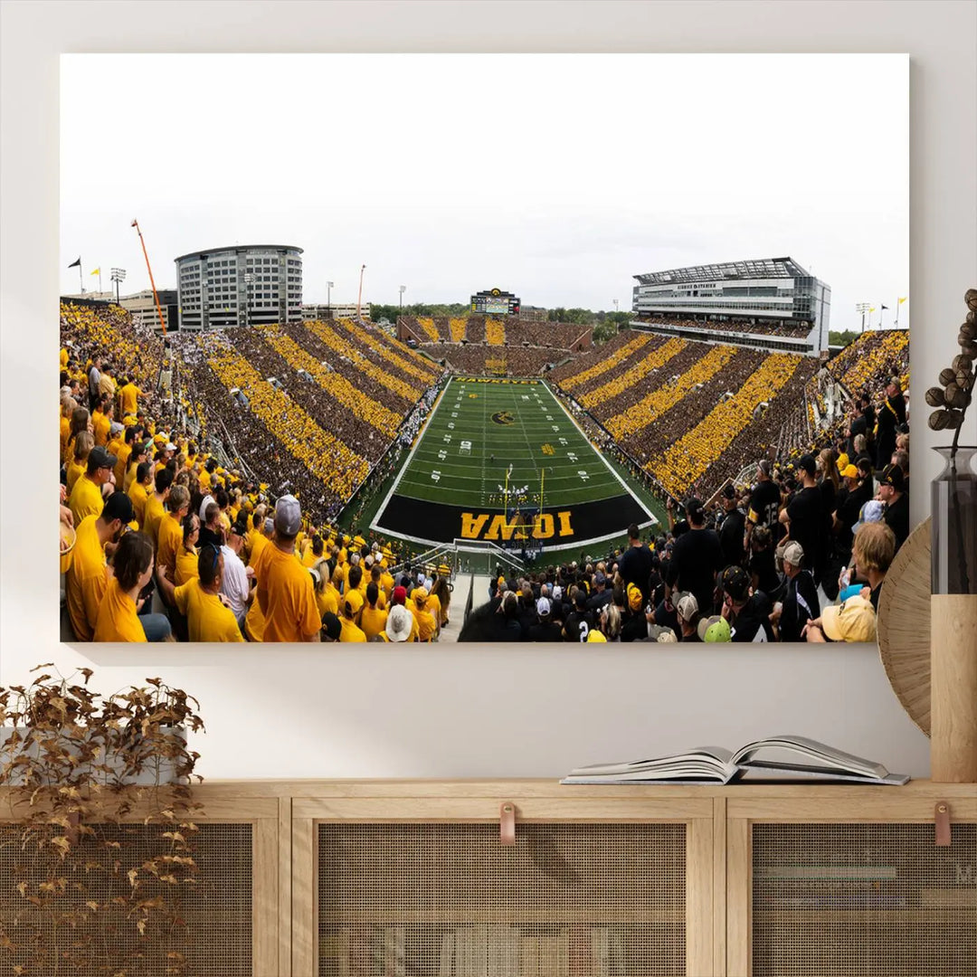 A handmade wall art print on premium canvas depicting the Iowa University Hawkeyes at a bustling Kinnick Stadium in Iowa City, capturing the vibrant scene from an end zone perspective.