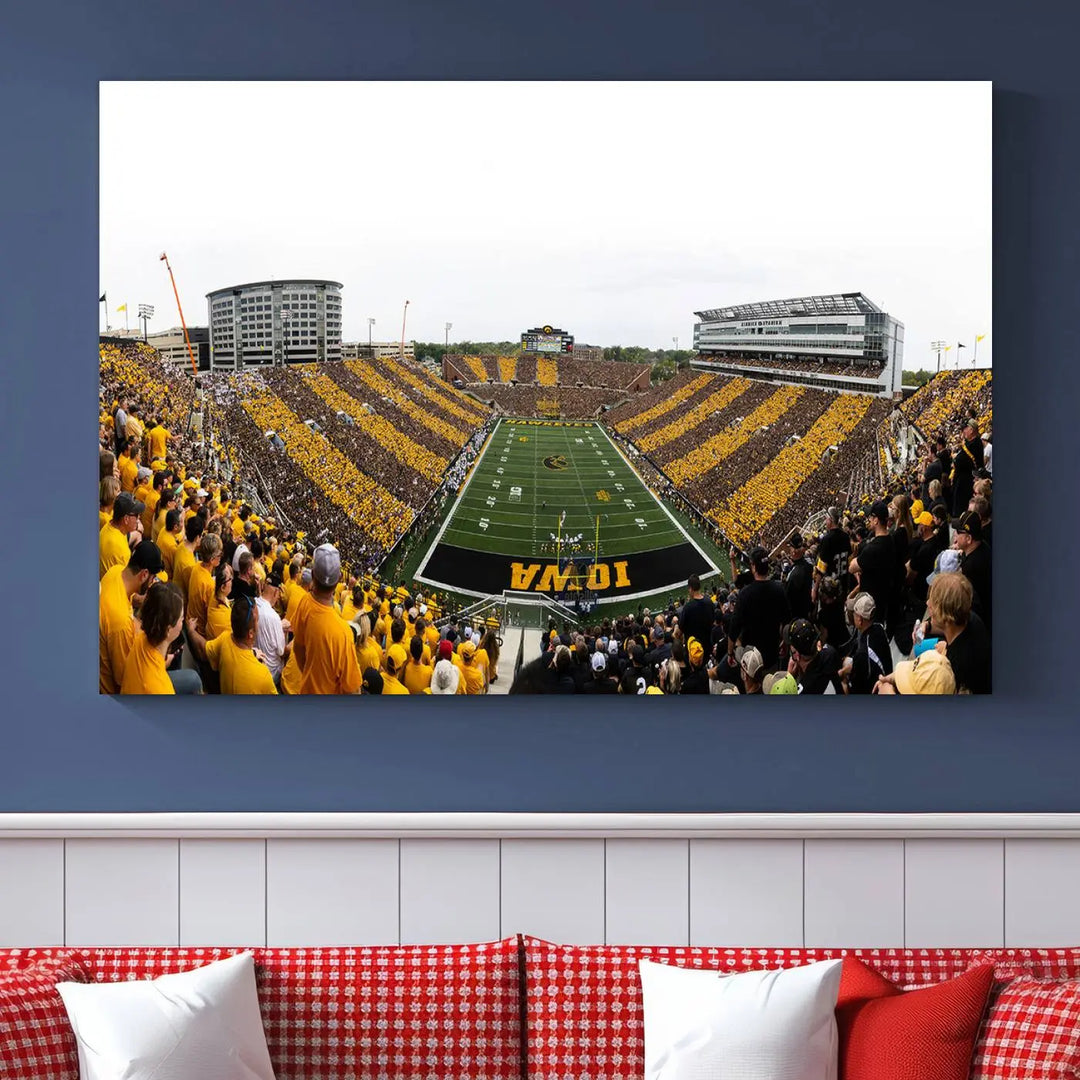 A handmade wall art print on premium canvas depicting the Iowa University Hawkeyes at a bustling Kinnick Stadium in Iowa City, capturing the vibrant scene from an end zone perspective.