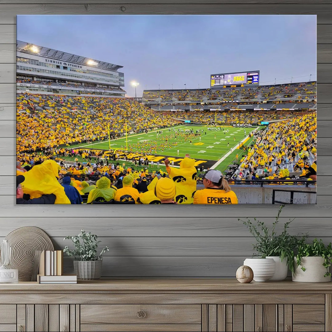 The "Iowa University Hawkeyes Football Team Print - Iowa City Kinnick Stadium Wall Art Canvas Print" captures the vibrant atmosphere of a packed Kinnick Stadium, buzzing with Iowa University Hawkeyes fans. This stunning wall art transforms the scene into a gallery-quality finish on premium canvas, bringing energy and excitement to any room.