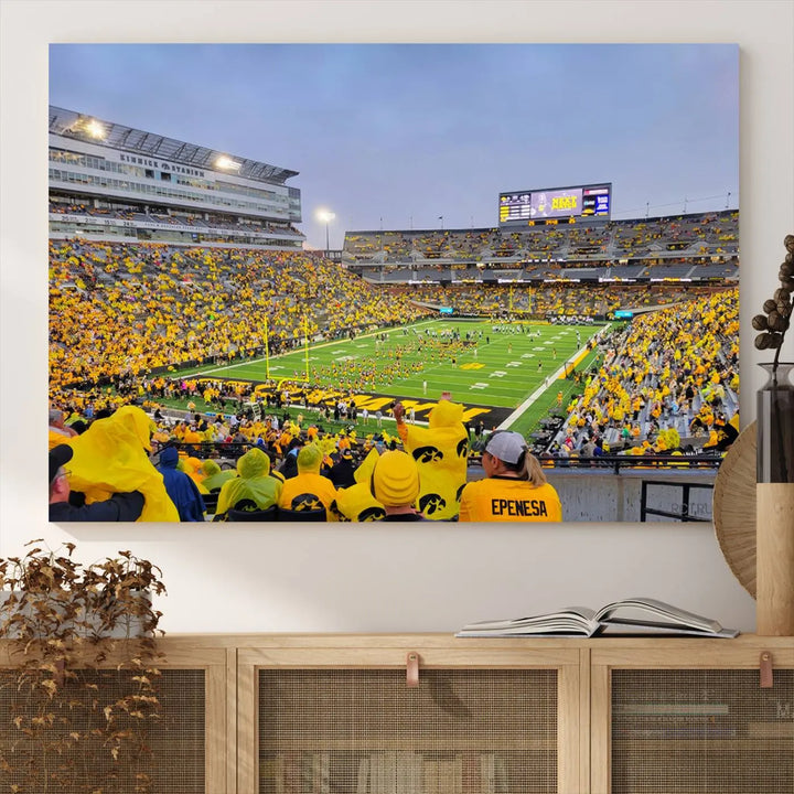 The "Iowa University Hawkeyes Football Team Print - Iowa City Kinnick Stadium Wall Art Canvas Print" captures the vibrant atmosphere of a packed Kinnick Stadium, buzzing with Iowa University Hawkeyes fans. This stunning wall art transforms the scene into a gallery-quality finish on premium canvas, bringing energy and excitement to any room.