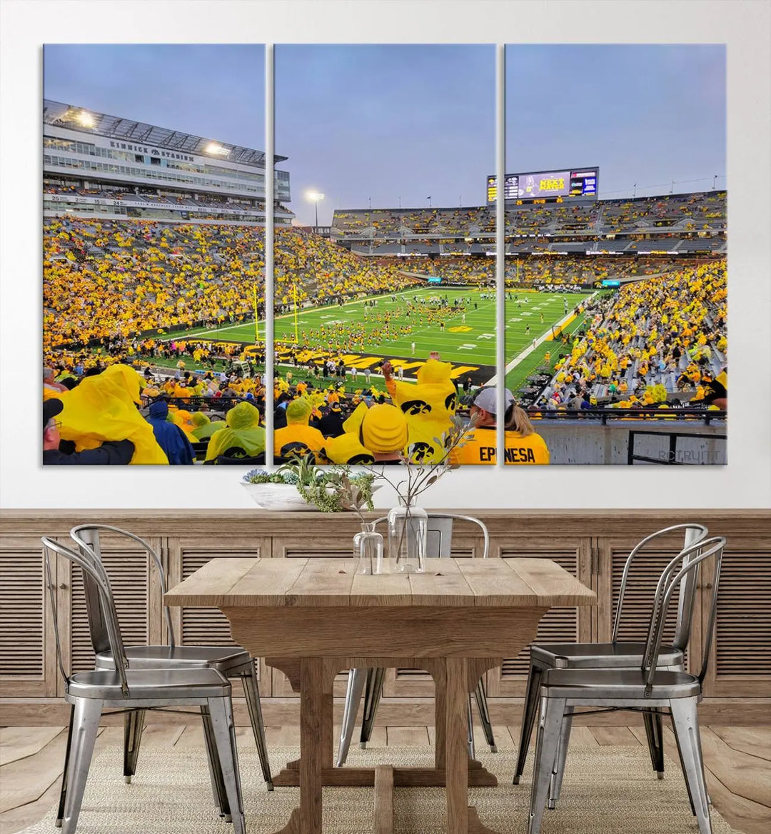 The "Iowa University Hawkeyes Football Team Print - Iowa City Kinnick Stadium Wall Art Canvas Print" captures the vibrant atmosphere of a packed Kinnick Stadium, buzzing with Iowa University Hawkeyes fans. This stunning wall art transforms the scene into a gallery-quality finish on premium canvas, bringing energy and excitement to any room.