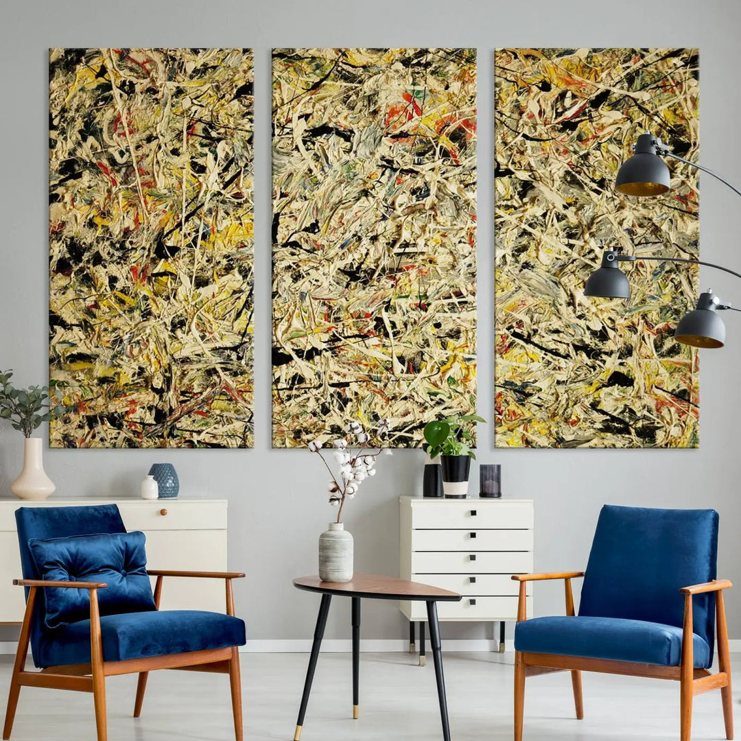 A Jackson Pollock Yellow Abstract Wall Art Canvas Print, featuring chaotic splashes of black, yellow, and red on a museum-quality canvas, is displayed prominently.