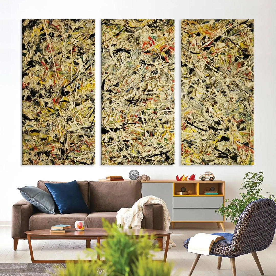 A Jackson Pollock Yellow Abstract Wall Art Canvas Print, featuring chaotic splashes of black, yellow, and red on a museum-quality canvas, is displayed prominently.