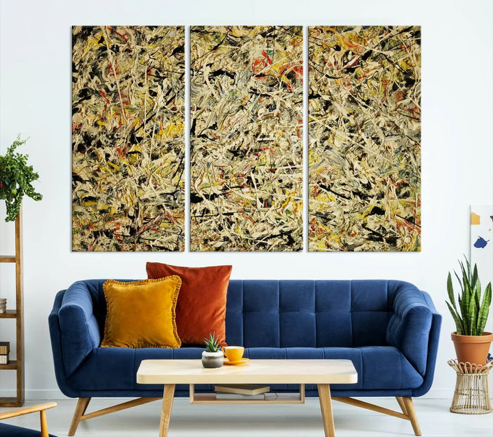 A Jackson Pollock Yellow Abstract Wall Art Canvas Print, featuring chaotic splashes of black, yellow, and red on a museum-quality canvas, is displayed prominently.