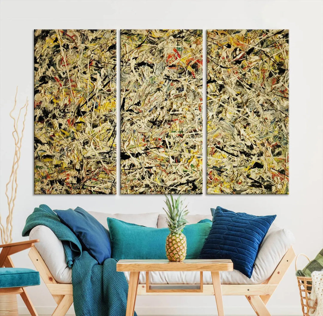 A Jackson Pollock Yellow Abstract Wall Art Canvas Print, featuring chaotic splashes of black, yellow, and red on a museum-quality canvas, is displayed prominently.